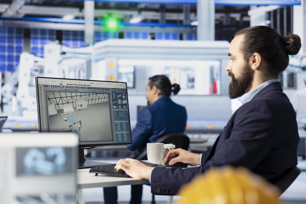 Panel operatorski w krakowskim zakładzie przemysłowym – wizualizacja danych w systemie kontroli produkcji.